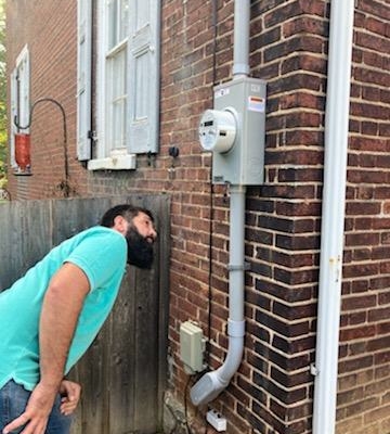 Kevin Smoker inspecting an electrical box